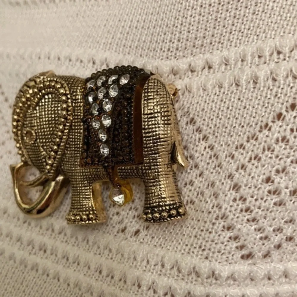Gorgeous gold tone and crystal elephant brooch